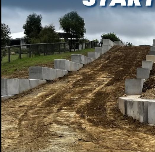 Steep driveway before concreting — excavated earth ramp