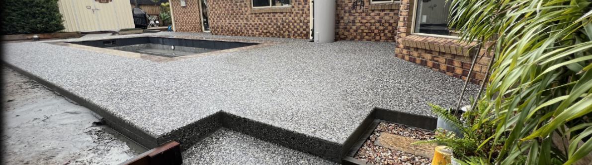Exposed aggregate pool surround